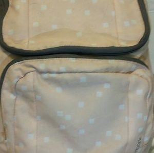 A pink white and grey backpack